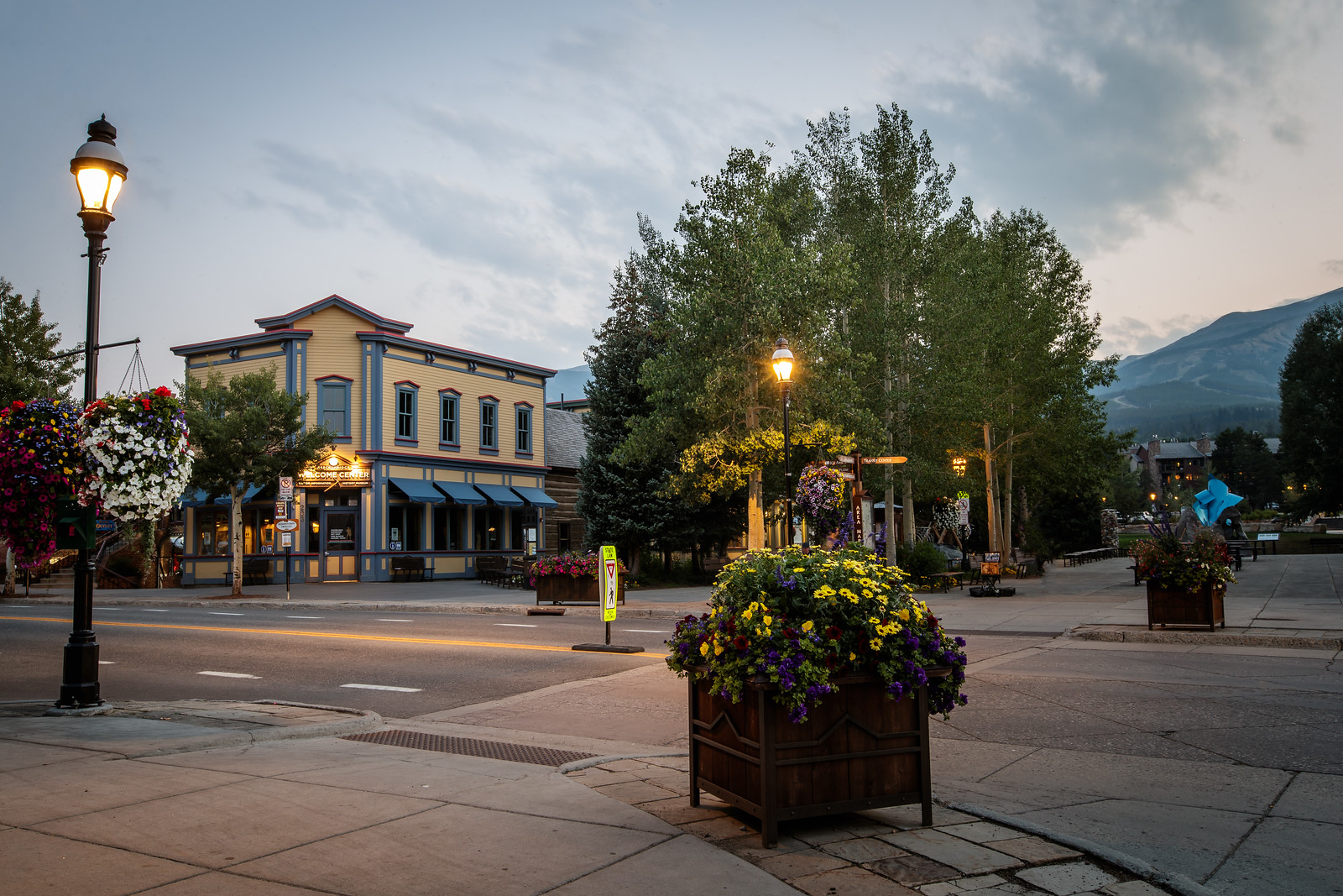 shot from the corner of main street with the Welcome Center and mountains in the background